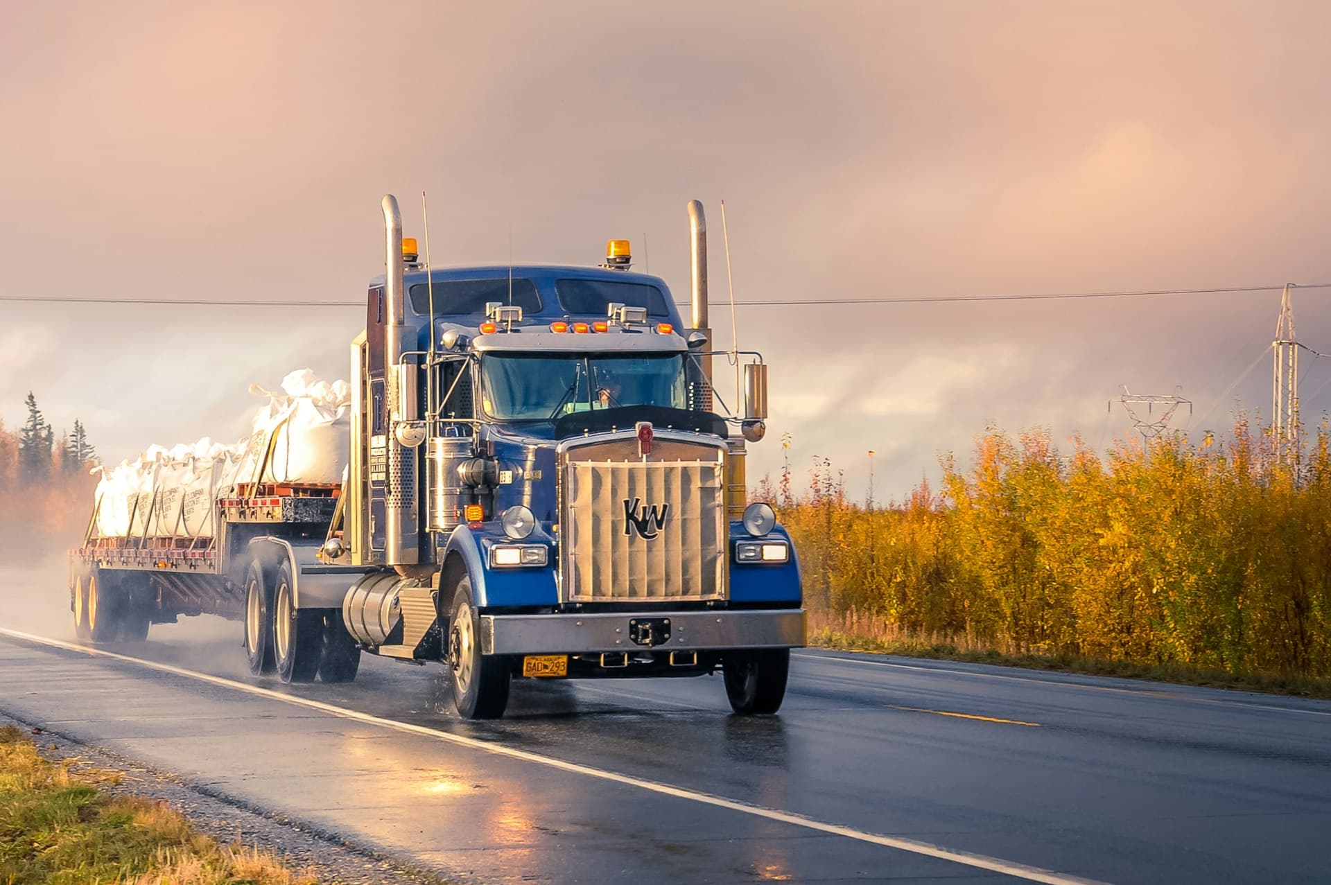 Long-haul truck driving through mountain roads